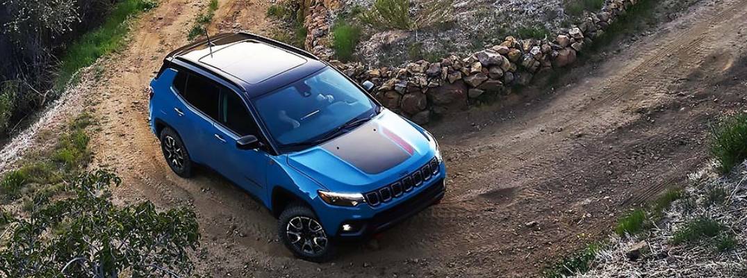 2026 Jeep Compass driving on dirt path