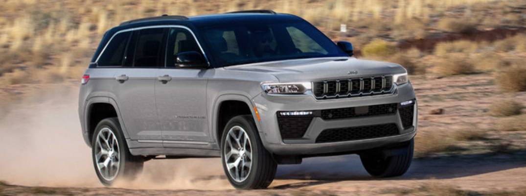 2026 Jeep Grand Cherokee driving through dirt terrain