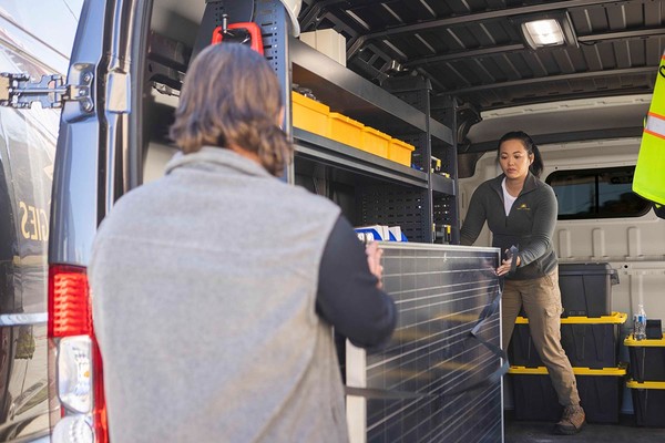 People working in 2026 Ram ProMaster.