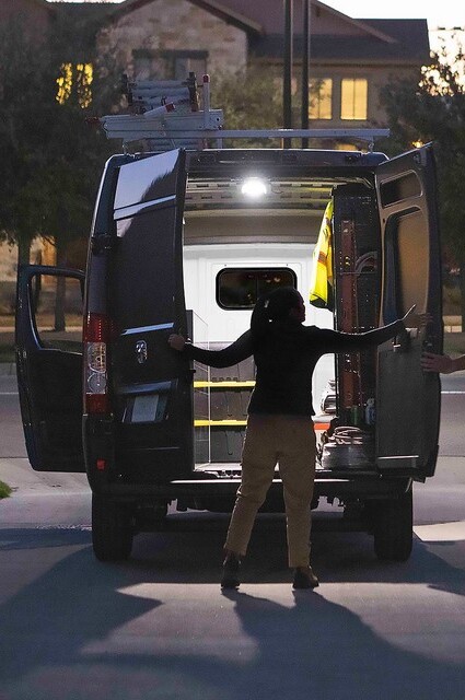 Person holding rear doors of 2026 Ram ProMaster open