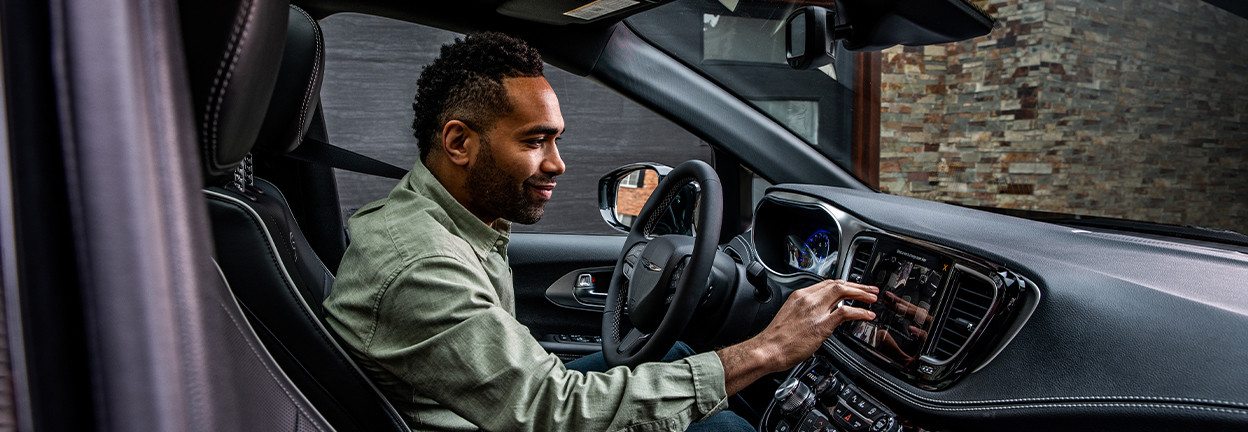 Unknown person using multimedia system inside2026 Chrysler Pacifica.