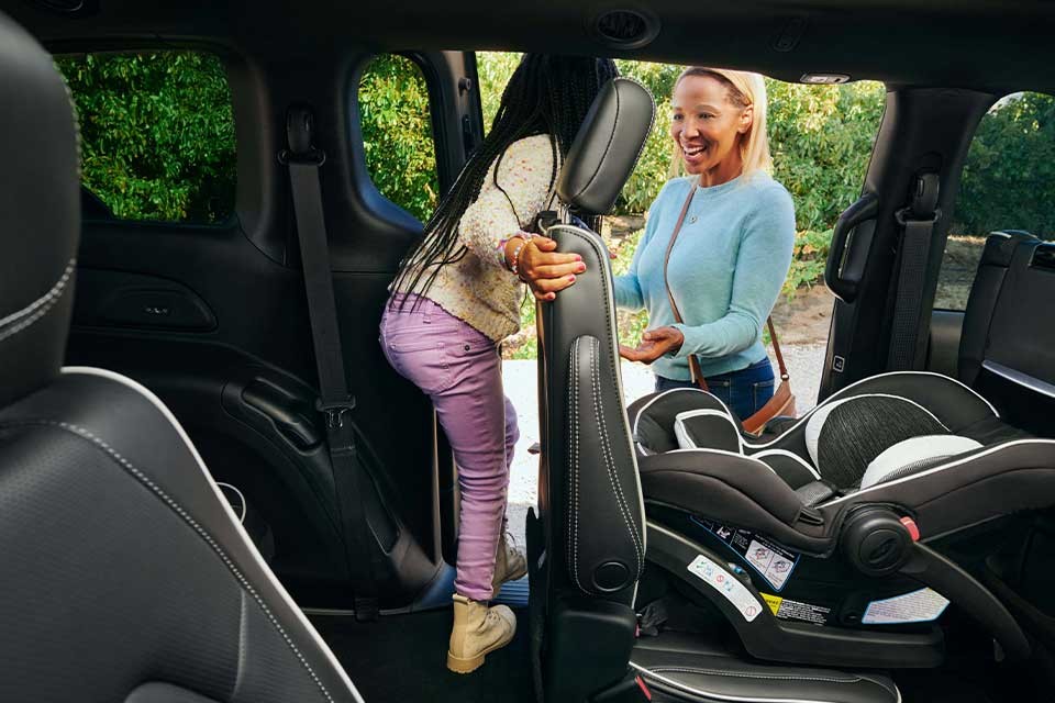 Child leaving third row of 2026 Chrysler Pacifica.