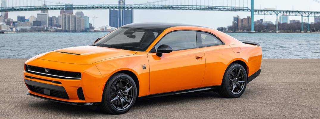 2026 Dodge Charger parked on pathway near body of water