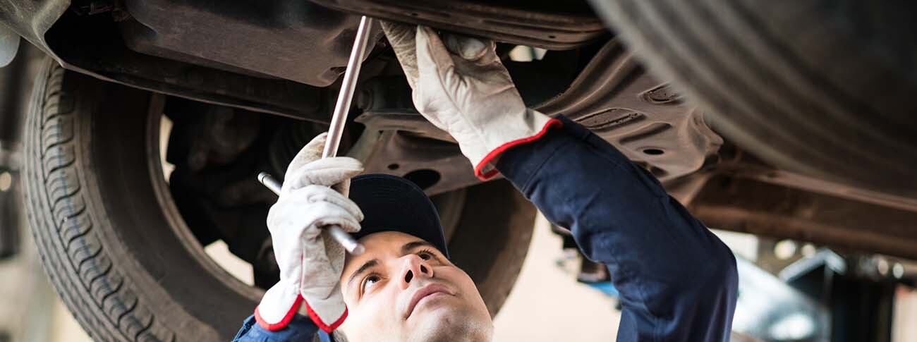 Tech working on vehicle