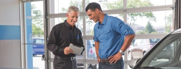 Unknown person speaking with service tech